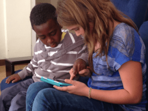 Ermias-and-MacKenzie-playing-with-iPad-300x225